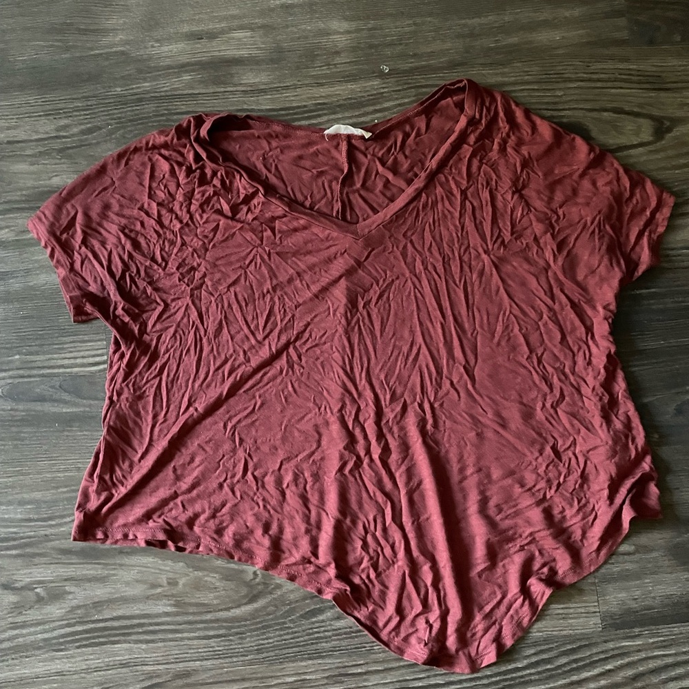 Cropped maroon tee. Longer on one side as shown.